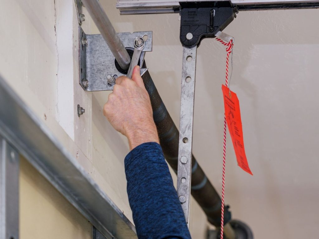 Garage Door Maintenance Slows Structural Wear on Springs, Rollers, and Tracks