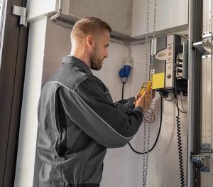 expert repairing garage door