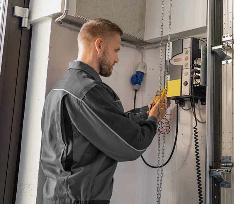 expert repairing garage door